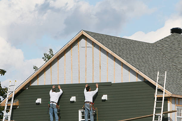 Professional Siding technician working in Kensington, MD